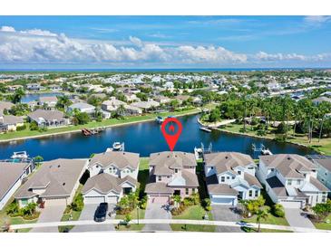 Beautiful waterfront property featuring a lovely home and dock access to a scenic canal with ocean access at 5221 Wishing Arch Dr, Apollo Beach, FL 33572