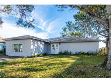 Single story home with front yard and mature trees at 12417 84Th Way, Largo, FL 33773