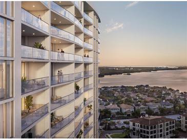 Luxury high-rise building with balconies offering stunning water views at 5701 Bowen Daniel Dr. # 402, Tampa, FL 33616
