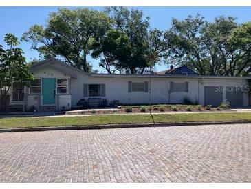 Charming single story home with a well-maintained lawn and quaint curb appeal at 415 21St N St, St Petersburg, FL 33713
