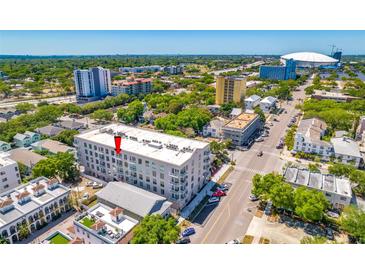 Stunning aerial view of modern condo building with vibrant cityscape backdrop, and convenient street access at 644 3Rd S Ave # 508, St Petersburg, FL 33701