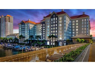 Stunning waterfront condo building with a marina, lush landscaping, and gorgeous architecture at 700 S Harbour Island Blvd # 226, Tampa, FL 33602