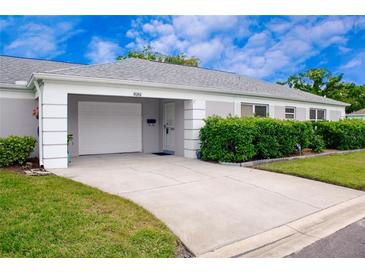 Charming single-story home with well-manicured lawn and attached garage at 8086 Annwood Rd, Seminole, FL 33777