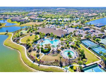 An aerial shot of a community pool, complete with pools, and landscaping at 5426 Rushmere Ct, Palmetto, FL 34221