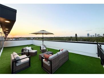 Inviting rooftop deck features lounge seating, perfect for enjoying panoramic city views and outdoor relaxation at 2116 4Th S St, St Petersburg, FL 33705