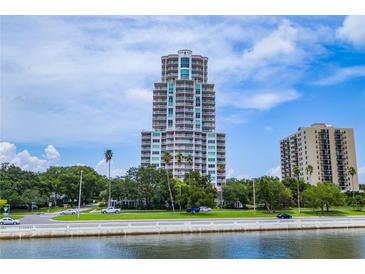 Stunning high-rise condo building with beautiful balconies and waterfront views, surrounded by lush landscaping at 3507 Bayshore Blvd # 102, Tampa, FL 33629