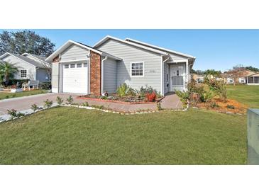 Charming single-Gathering home featuring a well-manicured lawn and inviting curb appeal at 37401 Wedgewood Dr, Zephyrhills, FL 33542