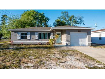 Charming single-story home featuring well-maintained landscaping and a cozy front porch at 895 64Th S Ave, St Petersburg, FL 33705
