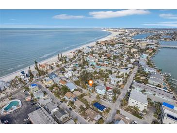 Island home near clear ocean and white sand beaches offering stunning coastal living in paradise at 128 Bay Plz, Treasure Island, FL 33706