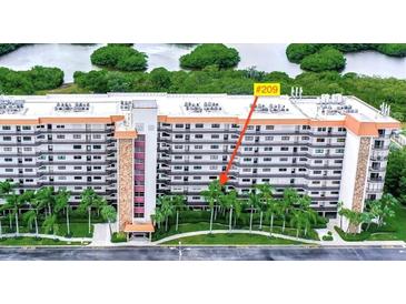 This shows the outside of the building and highlights unit #209 at 5400 Park N St # 209, St Petersburg, FL 33709