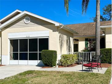 Charming single-story home with a screened-in garage and well-maintained landscaping at 2116 Nantucket Dr # 19, Sun City Center, FL 33573
