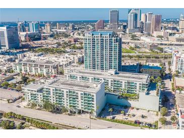 Stunning aerial view of a luxury apartment complex in downtown Tampa with modern architecture and beautiful city skyline backdrop at 111 N 12Th St # 1619, Tampa, FL 33602