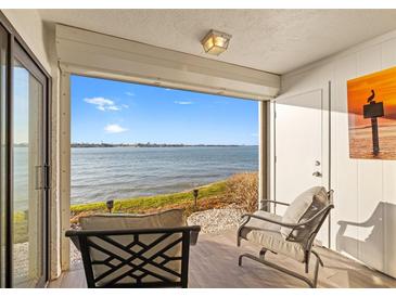 Relaxing patio with comfortable seating and a stunning waterfront view at 6265 Sun Blvd # 101, St Petersburg, FL 33715