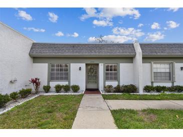 Charming home with a well-maintained front yard and inviting entryway with neutral colors at 4732 Lake Blvd # A, Clearwater, FL 33762