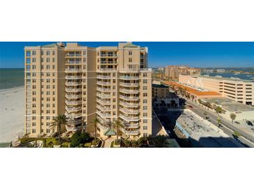 Beautiful condominium building with a view of the beach and the ocean at 10 Papaya St # 1404, Clearwater Beach, FL 33767
