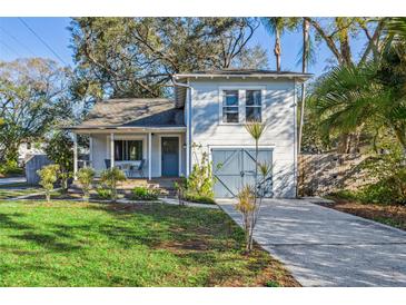 Charming home featuring a well-manicured lawn and a cozy front porch perfect for relaxing at 821 W Adalee St, Tampa, FL 33603