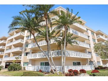 Multi-story condo building featuring private balconies, lush landscaping, and a coastal design at 1200 N Shore Ne Dr # 204, St Petersburg, FL 33701