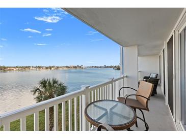 Enjoy this waterfront condo balcony with ample seating and stunning views at 500 Treasure Island Cswy # 308, Treasure Island, FL 33706