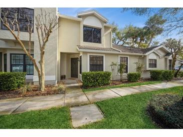 Inviting exterior of home featuring manicured landscaping, neutral colors, and a well-maintained walkway at 5100 Burchette Rd # 306, Tampa, FL 33647