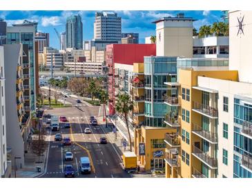 An expansive city view featuring modern architecture, vibrant street life, and blue skies at 1120 E Kennedy Blvd # 1126, Tampa, FL 33602