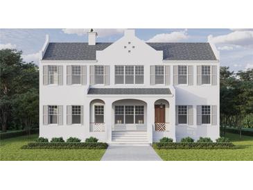 Stunning two-story white home features classic shutters and inviting front porch at 805 17Th Ne Ave, St Petersburg, FL 33704