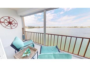 Relaxing balcony with comfortable seating and stunning waterfront views at 7910 Sun Island S Dr # 305, South Pasadena, FL 33707