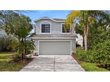 Charming two-story home with a well-manicured lawn and a two-car garage at 7086 Chatum Light Run, Bradenton, FL 34212