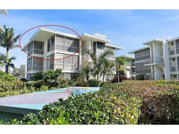 A condo building features a modern design and lush tropical landscaping at 1036 N Shore Ne Dr # 5, St Petersburg, FL 33701