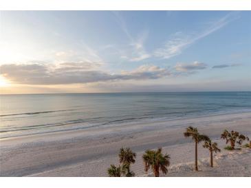 Expansive beach view with tranquil ocean waters and a picturesque horizon at 1600 Gulf Blvd # 512, Clearwater, FL 33767