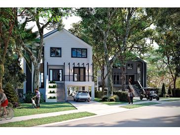 Beautiful two-story homes with lush landscaping and private driveways, perfect for luxury living at 1870 Stevenson Ave, Clearwater, FL 33755