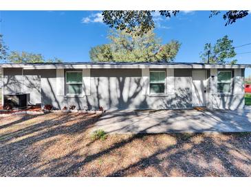 Charming single story home with a well-maintained lawn and mature trees in a tranquil neighborhood at 39809 Pretty Pond Rd, Zephyrhills, FL 33540