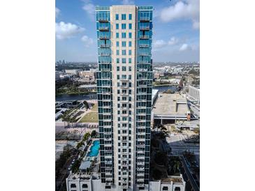 Stunning high-rise building featuring modern architecture, balconies, and beautiful city and water views at 777 N Ashley Dr # 1915, Tampa, FL 33602