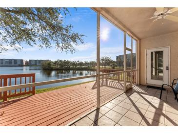 Enjoy the waterfront view from this screened-in patio with a ceiling fan and tile flooring at 6311 99Th N Way # 11B, St Petersburg, FL 33708