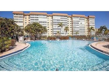 Large swimming pool with plenty of space for swimming in front of a large building at 5108 Brittany S Dr # 903, St Petersburg, FL 33715