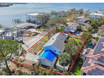 Waterfront property boasts serene views with ample space and desirable location near the water at 19 Sandpiper Rd, Tampa, FL 33609