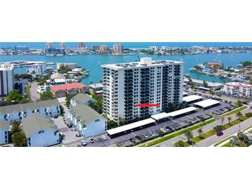 High-rise condo building with covered parking and bay views in a waterfront neighborhood at 400 Island Way # 612, Clearwater Beach, FL 33767