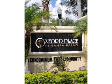 Oxford Place at Tampa Palms condominium community sign with lush landscaping at 5125 Palm Springs Blvd # 1101, Tampa, FL 33647