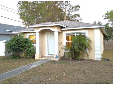 Charming single-story home with stucco exterior, arched doorway, and well-maintained landscaping at 926 43Rd S St, St Petersburg, FL 33711