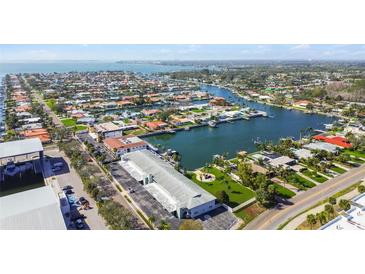 Expansive aerial view of the neighborhood waterfront with lush greenery and picturesque waterfront homes at 3717 46Th S Ave # 7, St Petersburg, FL 33711