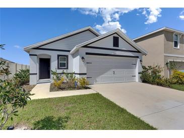 Charming single-story home with a two-car garage and well-maintained landscaping at 5617 Flagstone Trl, Palmetto, FL 34221