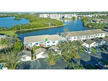 Scenic aerial view of the condo complex with waterfront views and lush landscaping at 6401 99Th N Way # 15C, St Petersburg, FL 33708
