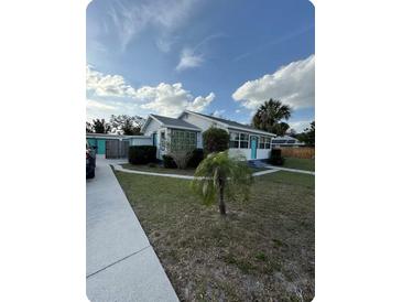 Charming single-story home with well-maintained lawn and inviting curb appeal at 1564 S Michigan Ave, Clearwater, FL 33756