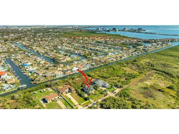 Stunning aerial view showcases waterfront homes and community in a beautiful Tampa Bay setting at 4707 Troydale Rd, Tampa, FL 33615