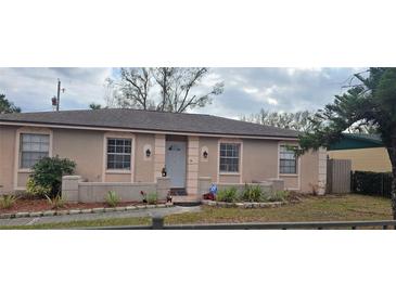 Charming single-story home with well-maintained front yard and classic architectural details at 7413 Sherren Dr, Tampa, FL 33619