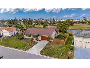 Single Gathering home with mature trees, well maintained lawn, and close proximity to water at 811 Eagle Ln, Apollo Beach, FL 33572