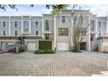 Charming townhomes featuring private garages, landscaped entrances, and brick paver driveways at 5010 Bayshore Blvd # 9, Tampa, FL 33611