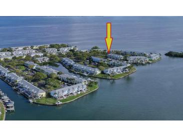 An aerial view of waterfront condos with boat docks near the water's edge at 5231 Beach Se Dr # A, St Petersburg, FL 33705