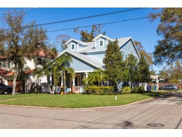 Charming two-story home with a manicured lawn and inviting front porch at 4301 W San Luis St, Tampa, FL 33629