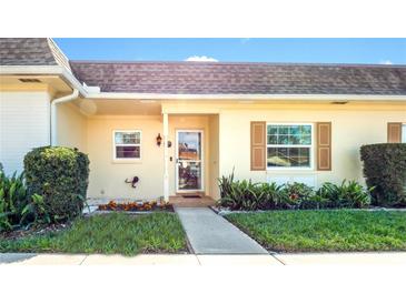 Charming home exterior with manicured lawn and a welcoming front entrance at 1662 S Lake Ave # 2, Clearwater, FL 33756