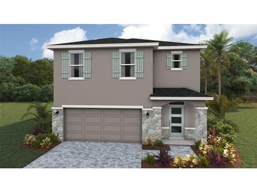 Charming two-story home with a stone facade, attached two-car garage, and beautifully landscaped yard at 1808 Cobb Trl, Parrish, FL 34219